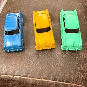 Vintage Vibrant Blue, Yellow, and Green Toy Car Trio